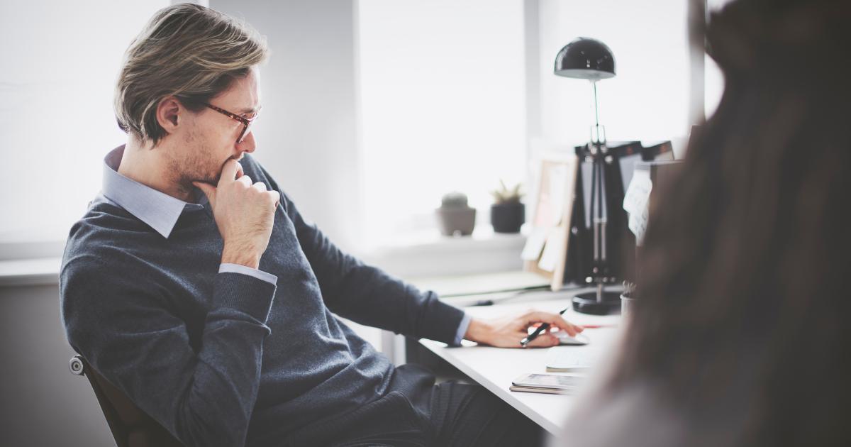 it professional in deep thought at desk