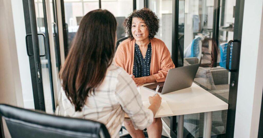 two professionals discussing retention initiatives