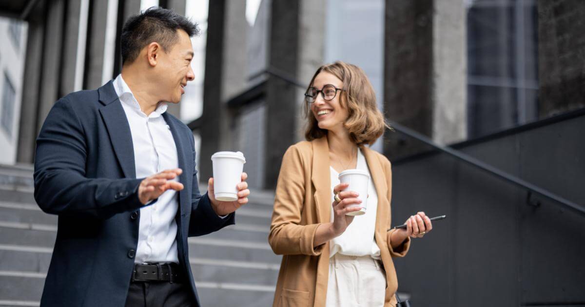 male and female professionals grabbing coffee in the morning