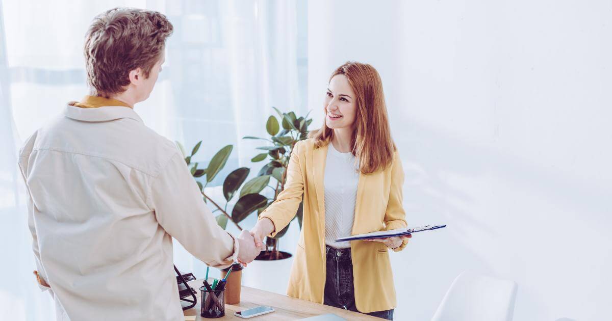 hiring manager shaking hands with staffing partner
