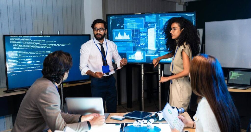 Team discussing AI data under pressure — the judgment CTOs rarely screen for in high-stakes hiring