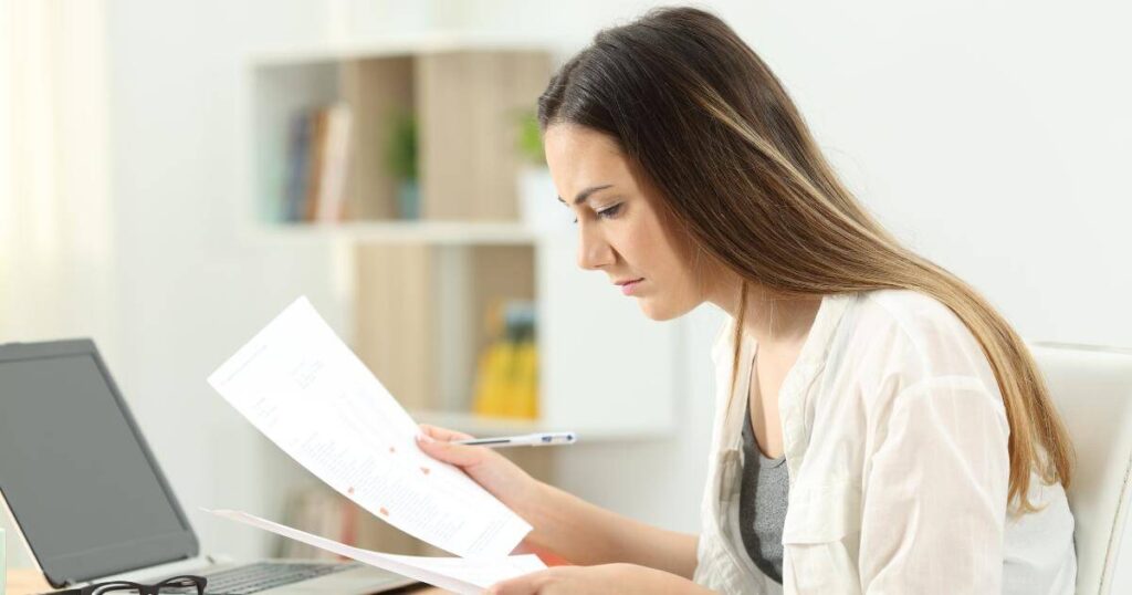 IT leader reviewing staffing documents, representing the challenge of evaluating IT recruiting partners for specialized roles