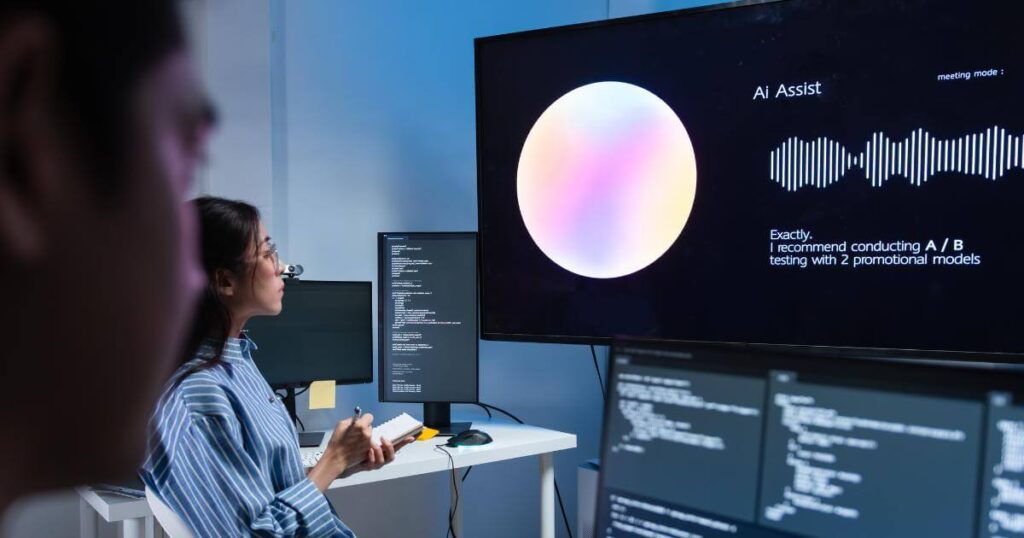 Woman and colleague reviewing an AI meeting assistant on screen