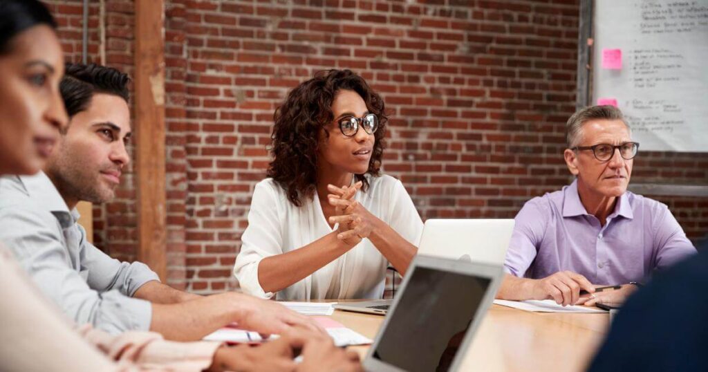 Team discussing strategy — the hiring gap most companies are quietly facing