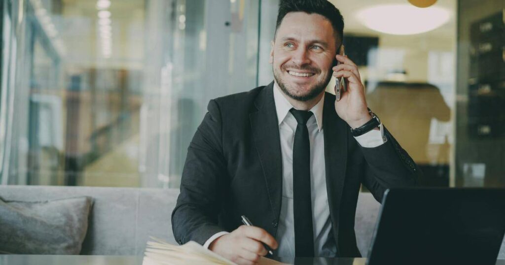 Business professional making a recruiting call, representing how niche IT talent is placed through direct recruiter relationships